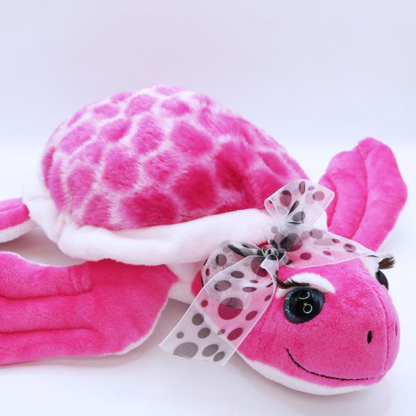 Peluche tortue marine rose avec grands cils